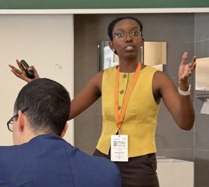 Woman making presentation with hands raised